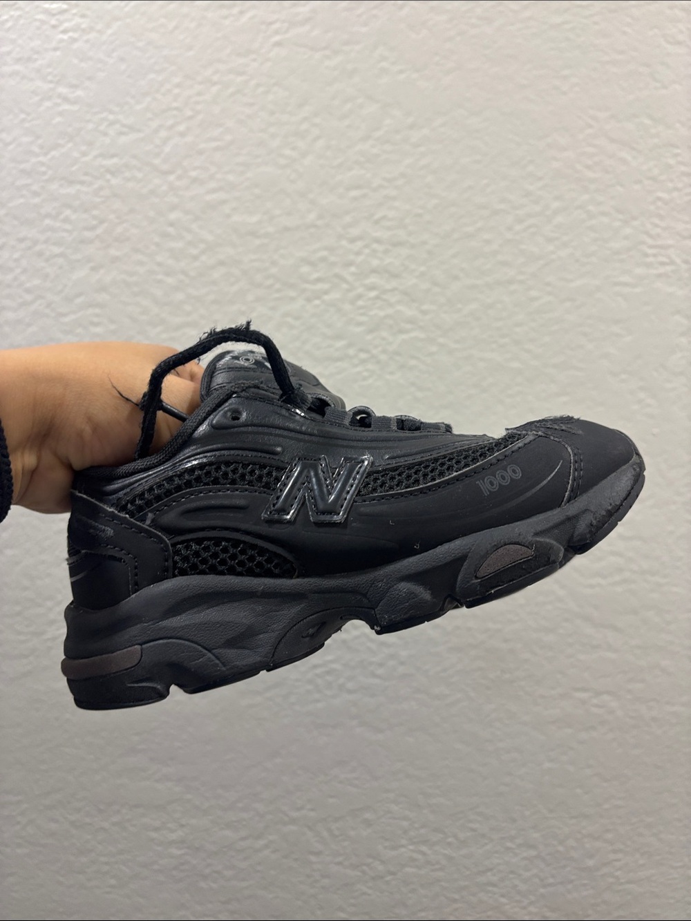 New Balance KIDS Black Low-Top Athletic Sneaker